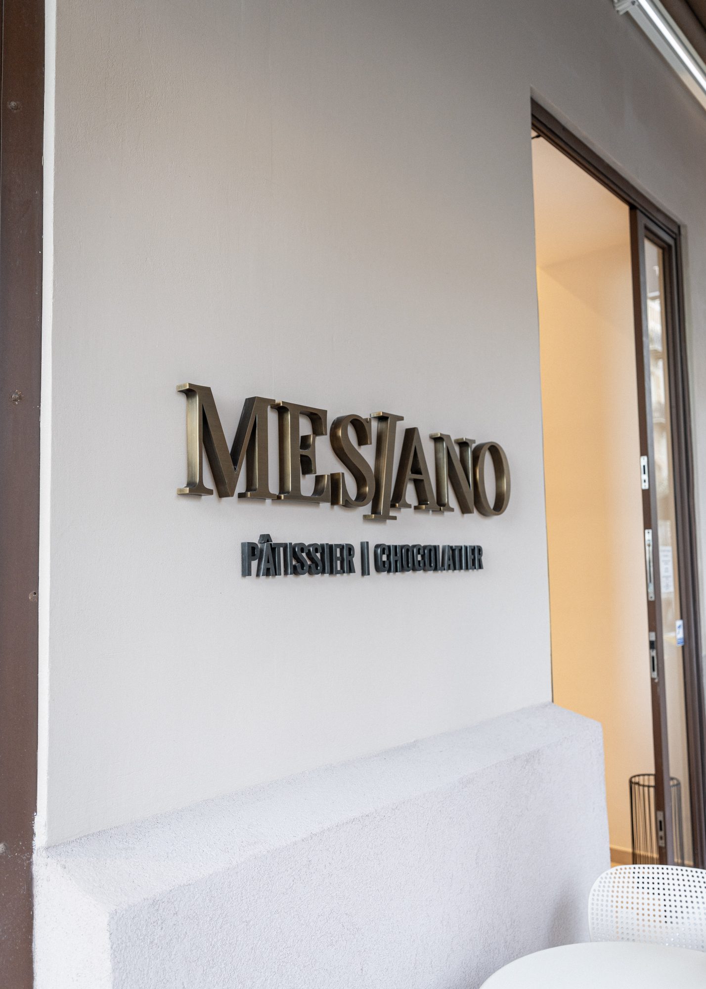 MESIANO brass letters on the façade