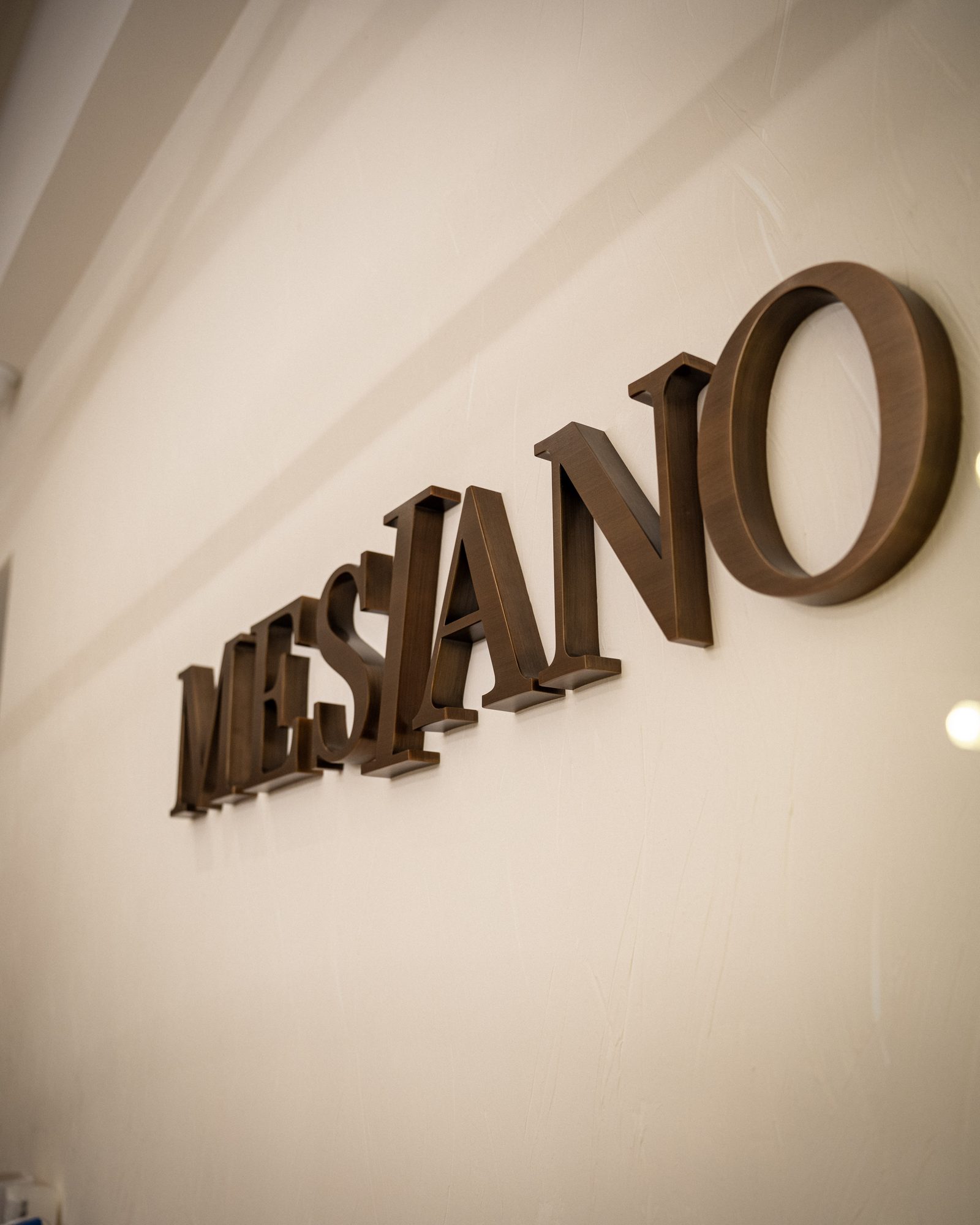 Interior brass MESIANO signage