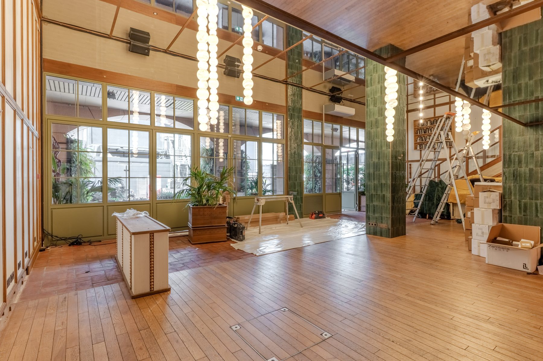 Stars of Monaco — main dining hall with green tile columns