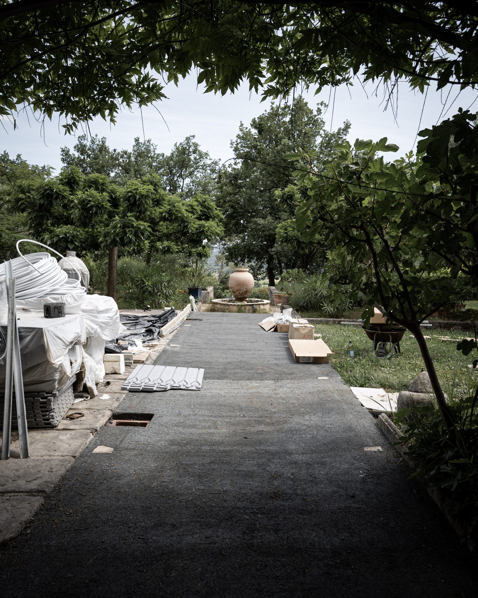 Dry-laid stone path being installed by craftsmen